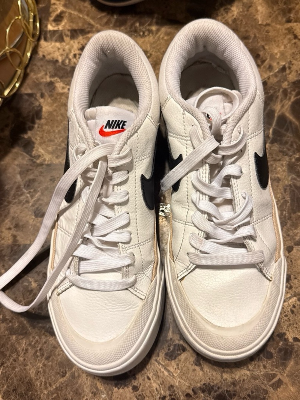 Nike White Leather Sneakers with Black Swoosh and Red Logo